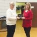 Photograph of Lena Custer presenting Janna Blosser with the award for Ruritan of the Year.