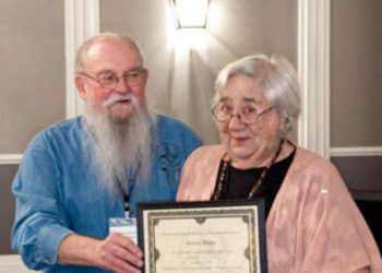 ASV President Mike Barber presents the Avocational Archeologist of the Year 2022 award to Janice Biller. (Photo credit: Terri Aigner, ASV webmaster)