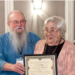 ASV President Mike Barber presents the Avocational Archeologist of the Year 2022 award to Janice Biller. (Photo credit: Terri Aigner, ASV webmaster)