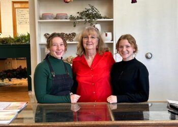 Evergreen Floral picture of women in a floral shop.