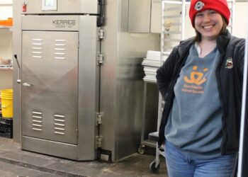 woman in a meat shop.