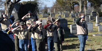 Boy Scouts at graveyard.