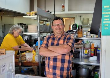 Man standing in a restaurant.