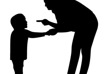 Silhouette of a child and man.